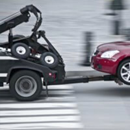 Free tow truck picking up a junk car